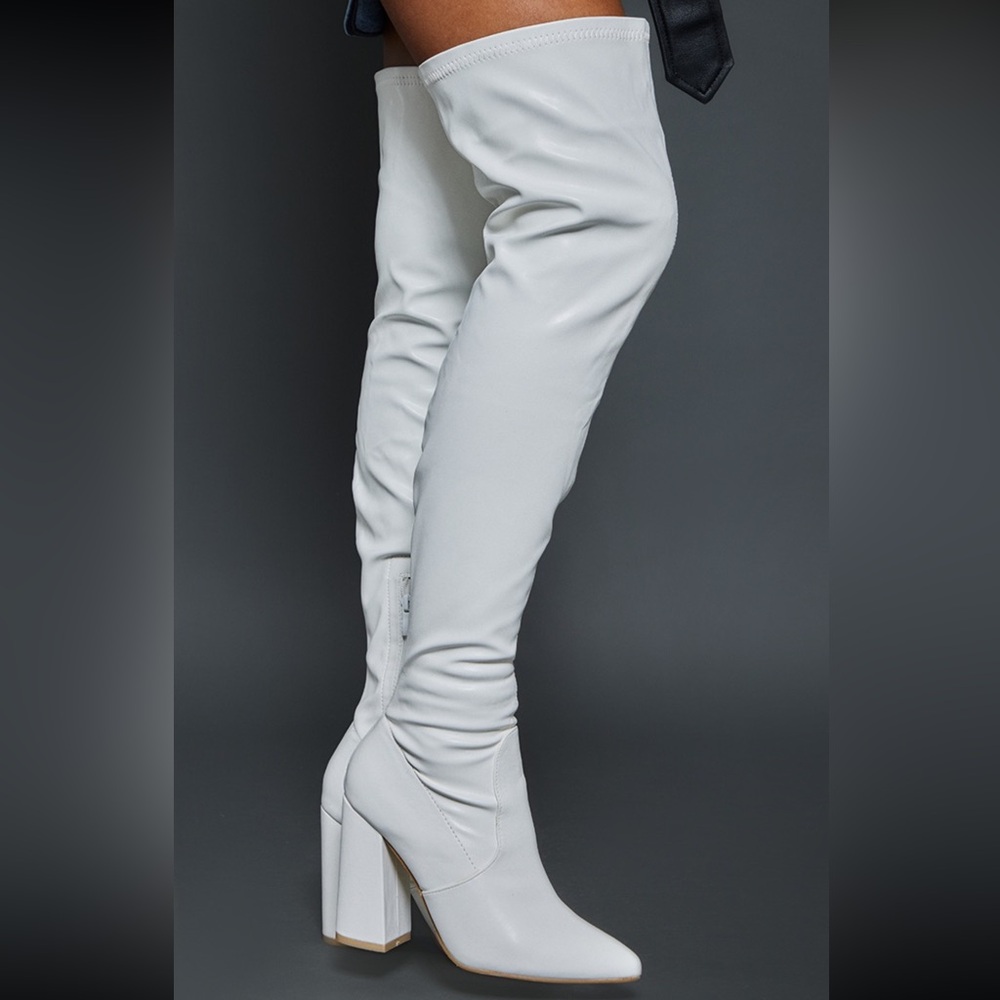 Stylish white knee-high heeled boots made from faux leather from PLT